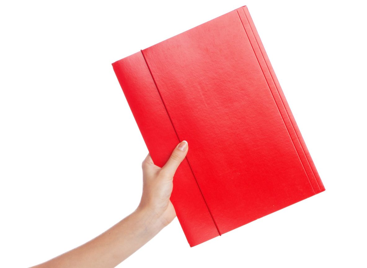 Hand holding a document folder, white background