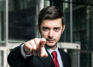 Businessman pointing his finger to you